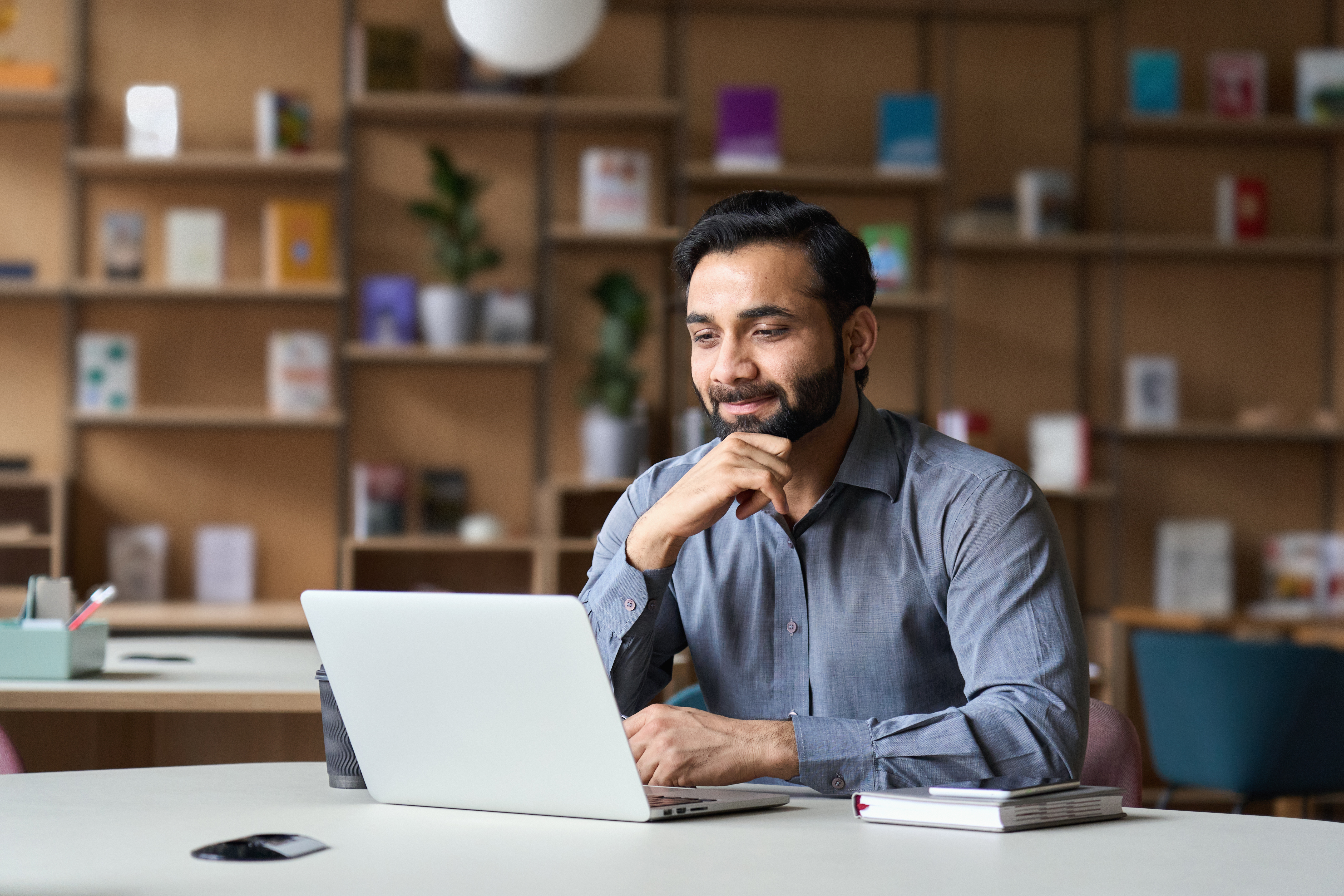 People reviewing their finances with a laptop and documents
