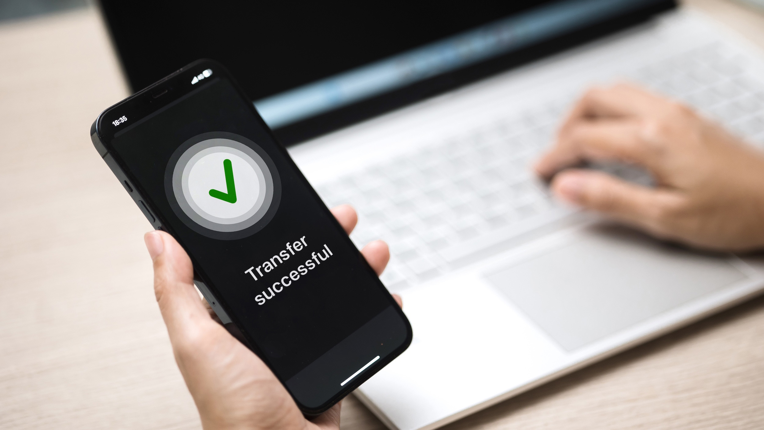 a phone screen showing a transfer confirmation